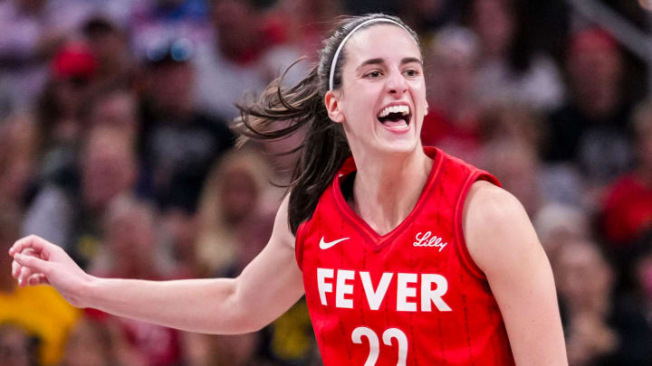 Indiana Fever guard Caitlin Clark (22) reacts after shooting a 3-pointer