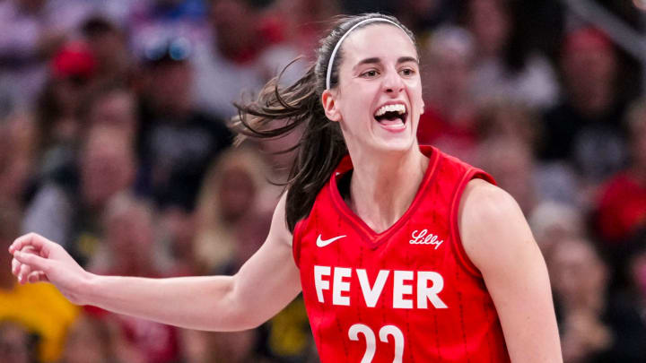 Indiana Fever guard Caitlin Clark (22) reacts after shooting a 3-pointer Friday, Aug. 16, 2024, during the game at Gainbridge Fieldhouse in Indianapolis.