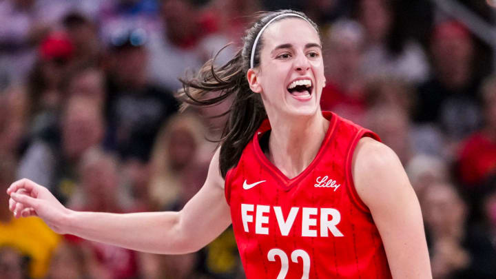 Indiana Fever guard Caitlin Clark reacts after shooting a 3-pointer Friday, Aug. 16, 2024, during the game at Gainbridge Fieldhouse in Indianapolis.