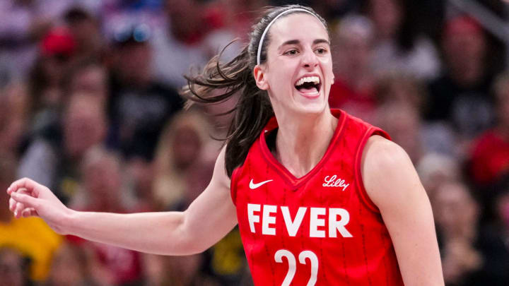 Indiana Fever guard Caitlin Clark (22) reacts after shooting a 3-pointer Friday, Aug. 16, 2024, during the game at Gainbridge Fieldhouse in Indianapolis.