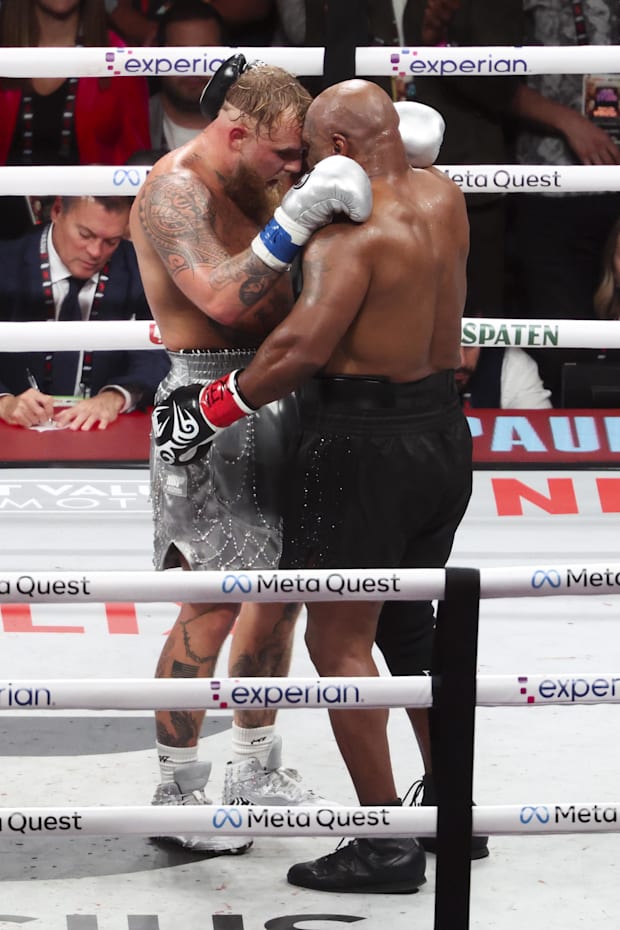 Jake Paul embraces Mike Tyson after their Netflix PPV