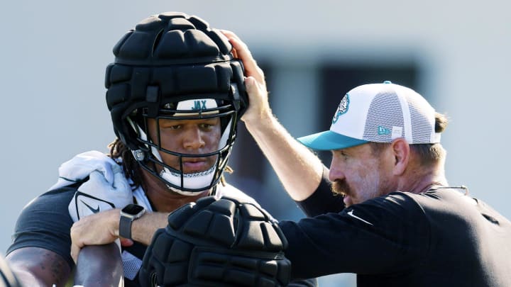 Jaguars defensive coordinator Ryan Nielsen gives instructions to Jacksonville Jaguars defensive end Roy Robertson-Harris (95) and defensive end Tyler Lacy (93) during the fourth day of the NFL football training camp practice session Saturday, July 27, 2024 at EverBank Stadium's Miller Electric Center in Jacksonville, Fla. [Bob Self/Florida Times-Union]