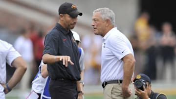 Sep 10, 2022; Iowa City, Iowa, USA; Iowa State Cyclones head coach Matt Campbell (left) and Iowa Hawkeyes head coach Kirk Ferentz (right) talk before the game at Kinnick Stadium. Mandatory Credit: Jeffrey Becker-Imagn Images