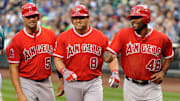 Aug 31, 2012; Seattle, WA, USA; Los Angeles Angels first baseman Albert Pujols (5) and designated hitter Kendrys Morales (8) and right fielder Torii Hunter (48) head back to the dugout after Morales hit a 3 run home run against the Seattle Mariners during the 1st inning at Safeco Field. Mandatory Credit: Steven Bisig-Imagn Images