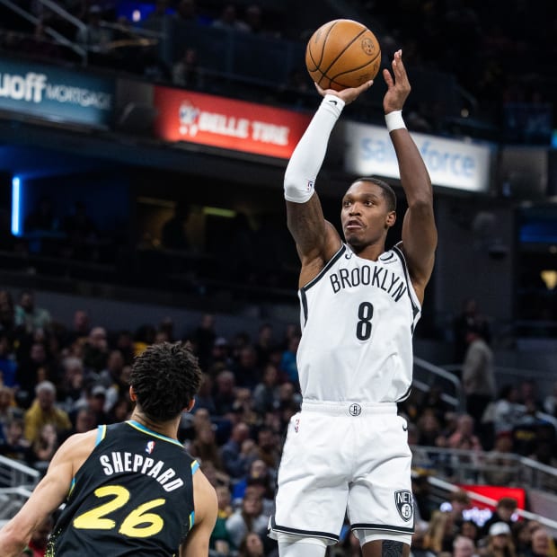 Brooklyn Nets guard Lonnie Walker IV (8) shoots the ball while Indiana Pacers guard Ben Sheppard (26) defends against him.