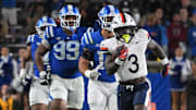 Nov 15, 2025; Durham, North Carolina, USA;  Virginia Cavaliers running back J'Mari Taylor (3) runs the ball past the Duke Blue Devils defense for a touchdown during the third quarter at Wallace Wade Stadium. Mandatory Credit: Zachary Taft-Imagn Images