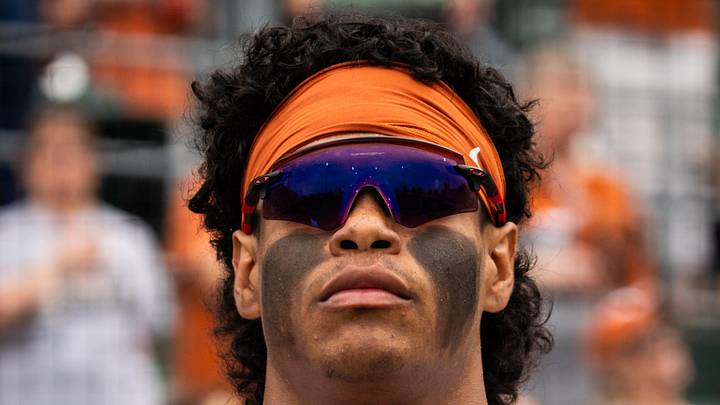 Texas Longhorns outfielder Jonah Williams (55) stands for the National Anthem as the Longhorns prepare to play the Auburn Tigers in the second game of a three-game series on Friday night at UFCU Disch-Falk Field in Austin, April 18, 2025.