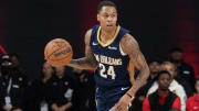 Oct 14, 2023; College Park, Georgia, USA; New Orleans Pelicans guard Jordan Hawkins (24) runs down the court against the Atlanta Hawks during the fourth quarter at Gateway Center Arena at College Park