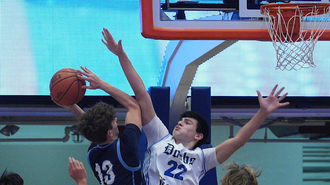 Westlake’s Marcus Jackette (13) finds his path to the basket blocked by Dobbs Ferry’s Anthony Ficarrotta (22) during boys basketball action in the Slam Dunk Showcase at the Westchester County Center Jan. 2, 2026.