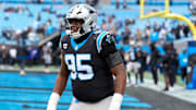 Nov 30, 2025; Charlotte, North Carolina, USA; Carolina Panthers defensive end Derrick Brown (95) warms up before the game against the Los Angeles Rams at Bank of America Stadium. 
