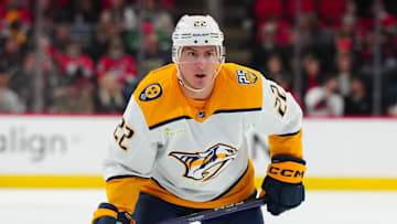 Dec 15, 2023; Raleigh, North Carolina, USA;  Nashville Predators defenseman Tyson Barrie (22) watches the play against the Carolina Hurricanes during the second period at PNC Arena. Mandatory Credit: James Guillory-Imagn Images