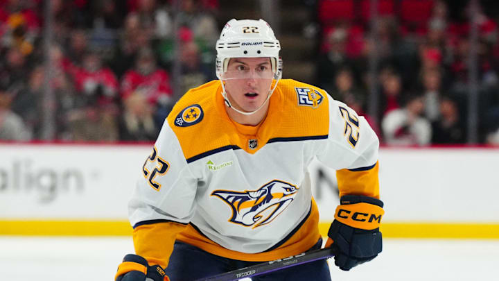 Dec 15, 2023; Raleigh, North Carolina, USA;  Nashville Predators defenseman Tyson Barrie (22) watches the play against the Carolina Hurricanes during the second period at PNC Arena. Mandatory Credit: James Guillory-Imagn Images