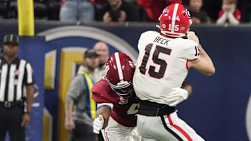 Dec 2, 2023; Atlanta, GA, USA;  Alabama Crimson Tide linebacker Chris Braswell (41) hits Georgia Bulldogs quarterback Carson Beck (15) as he throws, causing an incomplete pass at Mercedes-Benz Stadium. Alabama defeated Georgia 27-24 to claim the SEC Championship. Mandatory Credit: Gary Cosby Jr.-Imagn Images
