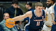 Jan 8, 2025; Berkeley, California, USA; Virginia Cavaliers guard Isaac McKneely (11) controls the basketball against California Golden Bears guard Jovan Blacksher Jr. (10) during the second half at Haas Pavilion. Mandatory Credit: Neville E. Guard-Imagn Images