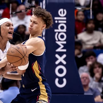 Apr 3, 2024; New Orleans, Louisiana, USA;  New Orleans Pelicans guard Dyson Daniels (11) fouls Orlando Magic forward Paolo Banchero (5) during the second half at Smoothie King Center. Mandatory Credit: Stephen Lew-Imagn Images