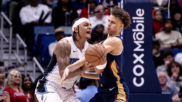 Apr 3, 2024; New Orleans, Louisiana, USA;  New Orleans Pelicans guard Dyson Daniels (11) fouls Orlando Magic forward Paolo Banchero (5) during the second half at Smoothie King Center. Mandatory Credit: Stephen Lew-Imagn Images