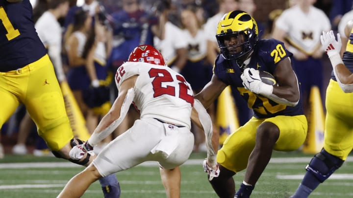 Aug 31, 2024; Ann Arbor, Michigan, USA;  Michigan Wolverines running back Kalel Mullings (20) rushes in the second half against the Fresno State Bulldogs at Michigan Stadium. Mandatory Credit: Rick Osentoski-USA TODAY Sports