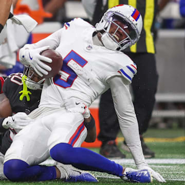Oct 13, 2025; Atlanta, Georgia, USA; Buffalo Bills wide receiver Josh Palmer (5) is tackled by. Atlanta Falcons cornerback Dee Alford (20)