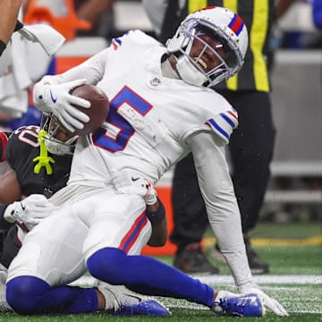 Oct 13, 2025; Atlanta, Georgia, USA; Buffalo Bills wide receiver Josh Palmer (5) is tackled by. Atlanta Falcons cornerback Dee Alford (20)