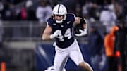 Nov 30, 2024; University Park, Pennsylvania, USA; Penn State Nittany Lions tight end Tyler Warren (44) runs with the ball against the Maryland Terrapins during the second quarter at Beaver Stadium. Penn State won 44-7. Mandatory Credit: Matthew O'Haren-Imagn Images