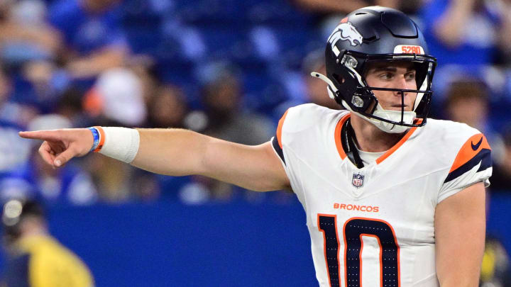 Aug 11, 2024; Indianapolis, Indiana, USA; Denver Broncos quarterback Bo Nix (10) points during the second quarter against the Indianapolis Colts at Lucas Oil Stadium. 