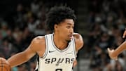 Oct 10, 2025; San Antonio, Texas, USA; San Antonio Spurs guard Dylan Harper (2) drives to the basket against Utah Jazz forward Kyle Anderson (0) during the first half at Frost Bank Center. Mandatory Credit: Scott Wachter-Imagn Images