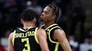 Jan 12, 2025; University Park, Pennsylvania, USA; Oregon Ducks guard Keeshawn Barthelemy (9) celebrates with guard Jackson Shelstad (3) after making a three-point basket during the first half against the Penn State Nittany Lions at Bryce Jordan Center. Oregon defeated Penn State 82-81. Mandatory Credit: Matthew O'Haren-Imagn Images