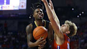 Florida Gators forward Thomas Haugh (10) guards Vanderbilt Commodores guard Jason Edwards (1) during the second half at Exactech Arena at the Stephen C. O'Connell Center.