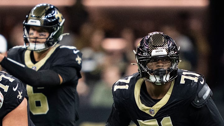 New Orleans Saints QB Tyler Shough (6) takes a snap while LT Kelvin Banks Jr. (71) blocks on Nov. 23, 2025.