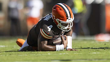 Oct 20, 2024; Cleveland, Ohio, USA; Cleveland Browns quarterback Deshaun Watson (4) falls to the ground with a torn Achilles during the second quarter against the Cincinnati Bengals at Huntington Bank Field. Mandatory Credit: Scott Galvin-Imagn Images