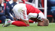 Martin Ødegaard (left) suffered a knee injury against West Ham United.