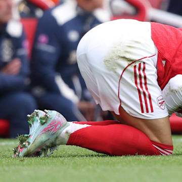 Martin Ødegaard (left) suffered a knee injury against West Ham United.