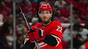 Mar 28, 2024; Raleigh, North Carolina, USA;  Carolina Hurricanes defenseman Brett Pesce (22) looks on against the Detroit Red Wings during the second period at PNC Arena. Mandatory Credit: James Guillory-USA TODAY Sports