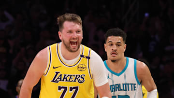 Feb 19, 2025; Los Angeles, California, USA; Los Angeles Lakers guard Luka Doncic (77) reacts after a play during the fourth quarter against the Charlotte Hornets at Crypto.com Arena. Mandatory Credit: Jason Parkhurst-Imagn Images