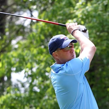Then Ole Miss coach Hugh Freeze tees off during a tournament in 2013. 