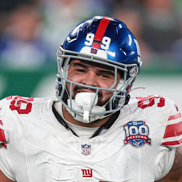 Aug 24, 2024; East Rutherford, New Jersey, USA; New York Giants defensive tackle Jordan Phillips (99) celebrates a defensive stop against the New York Jets during the second half at MetLife Stadium.  