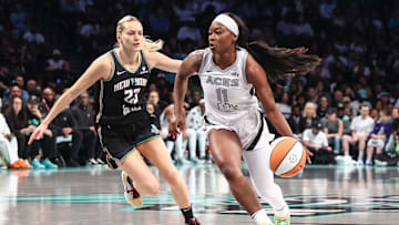 May 17, 2025; Brooklyn, New York, USA;  Las Vegas Aces guard Dana Evans (11) looks to drive past New York Liberty guard Marine Johannes (23) in the first quarter at Barclays Center. Mandatory Credit: Wendell Cruz-Imagn Images