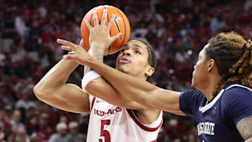 Arkansas Razorbacks guard Darius Acuff Jr (5) drives against Jackson State Tigers guard Jayme Mitchell Jr (3) during the second half at Bud Walton Arena.