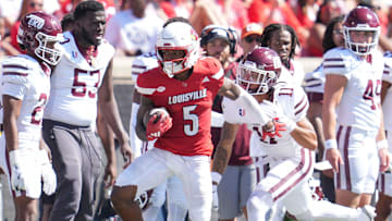 Louisville Cardinals wide receiver Caullin Lacy (5) gains yardage during the Cards' 51-17 win over Eastern Kentucky University at the Cardinals' season opener Saturday, August 30, 2025 at L&N Federal Credit Union Stadium in Louisville, Kentucky.