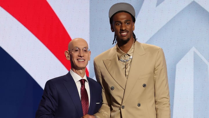Alexander Sarr poses for photos with NBA commissioner Adam Silver after being selected in the first round by the Washington Wizards.