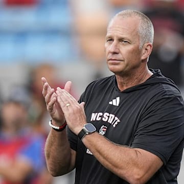 Sep 7, 2024; Charlotte, North Carolina, USA; North Carolina State Wolfpack head coach Dave Doeren during pregame activities against the Tennessee Volunteers at the Dukes Mayo Classic at Bank of America Stadium.