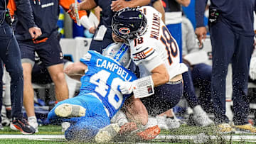 Detroit Lions linebacker Jack Campbell (46) tackles Chicago Bears quarterback Caleb Williams (18) during the second half at Ford Field in Detroit on Thursday, Nov. 28, 2024.