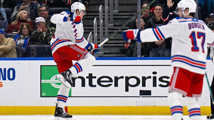 Feb 25, 2025; Elmont, New York, USA;  New York Rangers center Matt Rempe (73) celebrates his goal against the New York Islanders during the second period at UBS Arena. Mandatory Credit: Dennis Schneidler-Imagn Images