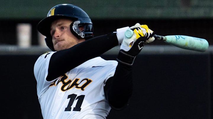 Iowa’s Miles Risley (11) follows through on a swing May 1, 2026 during a Big Ten baseball game against the Illinois Fighting Illini at Duane Banks Field in Iowa City, Iowa.
