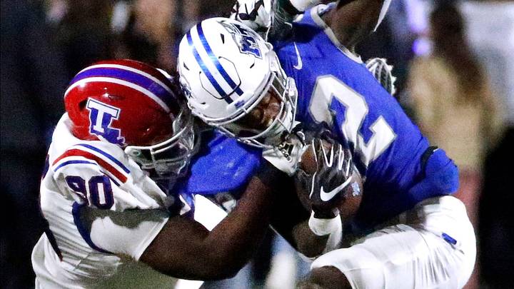 Middle Tennessee running back Jaiden Credle (22) runs the ball as he tries to shake off Louisiana Tech defensive lineman David Blay (90) during the football game in Floyd Stadium at Middle Tennessee, in Murfreesboro, Tenn. on Tuesday, Oct. 10, 2023.