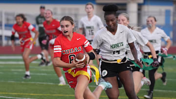 New Smyrna Beach's Molly Brock (8) eludes tacklers to run for a 43-yard touchdown against Weeki Wachee in a Class 2A, Region 2 quarterfinal game.