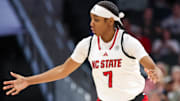 Nov 9, 2025; Charlotte, North Carolina, USA; NC State Wolfpack guard Destiny Lunan (7) loses the ball against the Southern California Trojans during the second quarter of the Ally Tipoff game at Spectrum Center. Mandatory Credit: Cory Knowlton-Imagn Images