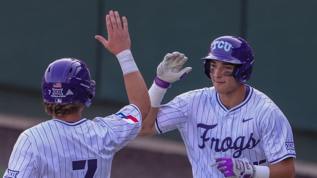Chase Brunson high fives Cole Cramer after recording an RBI against the Baylor Bears. (4/25/25)
