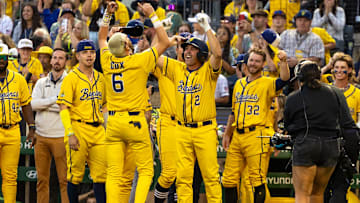 Longtime Pittsburgh Pirates shortstop Jack Wilson and Savannah Banana shortstop Ryan Cox embrace during the Savannah Bananas game against the Texas Tailgaters