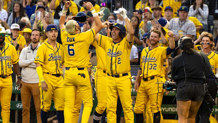 Longtime Pittsburgh Pirates shortstop Jack Wilson and Savannah Banana shortstop Ryan Cox (6) embrace during the Savannah Bananas game against the Texas Tailgaters Saturday, Aug. 30, 2025 at PNC Park in Pittsburgh, Pa. Longtime Pittsburgh Pirates shortstop Jack Wilson and Savannah Banana shortstop Ryan Cox (6) embrace during the Savannah Bananas game against the Texas Tailgaters Saturday, Aug. 30, 2025 at PNC Park in Pittsburgh, Pa.
